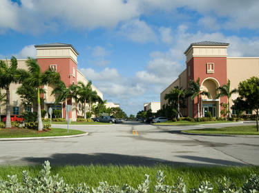Prologis Timeline - 1987 AMB shopping center, surrounded by palm trees