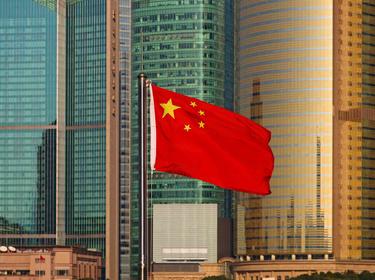 Prologis Timeline - 2003 Chinese flag shown flying next to skyscrapers
